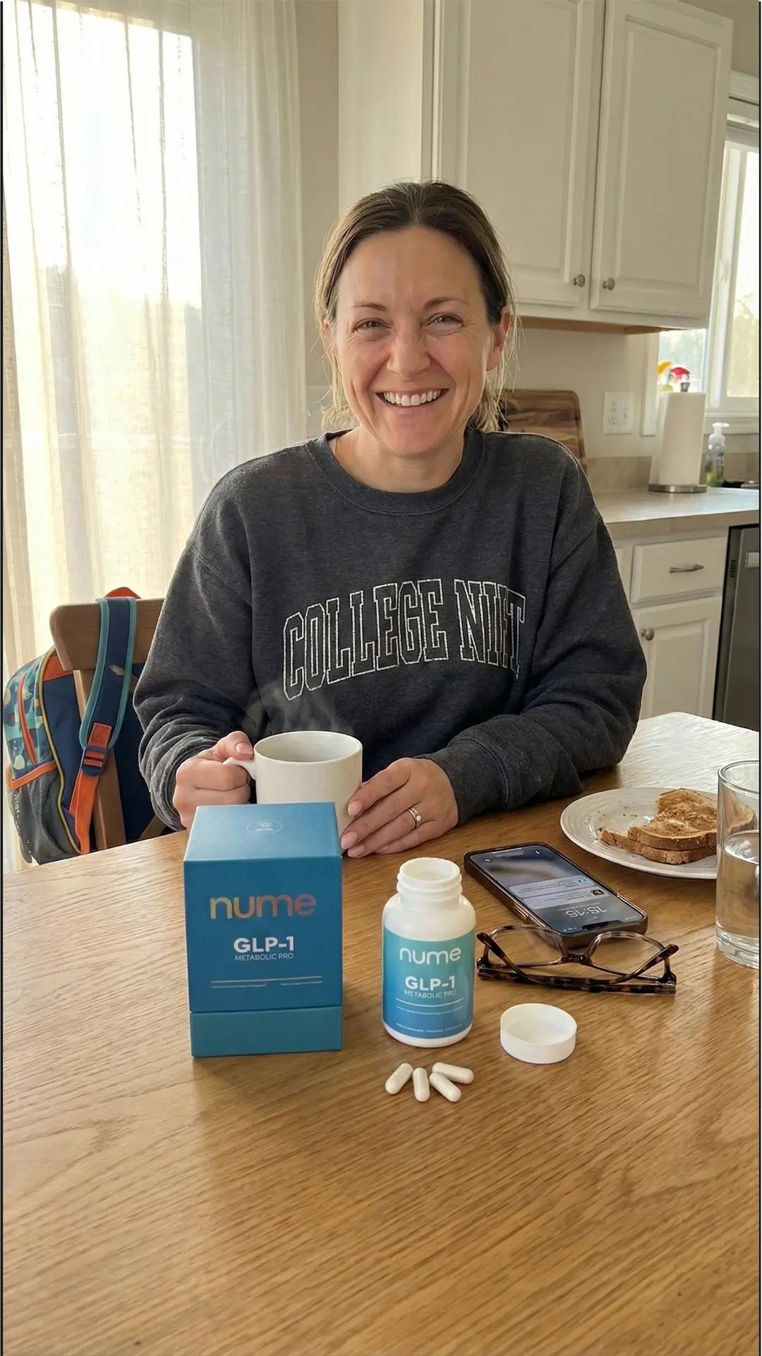 Woman at kitchen table with Nume GLP-1 supplements and morning coffee