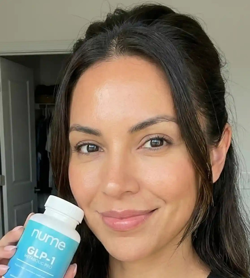 Nume customer smiling with GLP-1 Metabolic Pro bottle